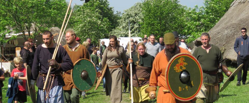 People dressed as Viking warriors in a Viking village