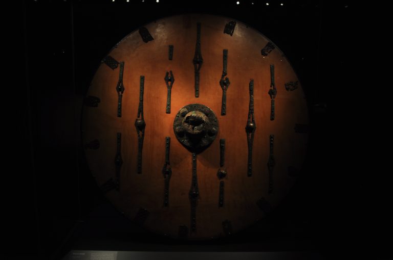 A round viking shield with a boss in the center