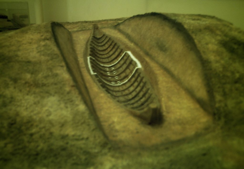 Model of the Sutton Hoo ship-burial 1, England. The placement of the burial chamber is marked white