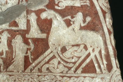 Detail of the Tjängvide picture stone from Gotland: a rider on an eight-legged horse, usually read as Odin on Sleipnir, greeted by a woman holding a drinking horn