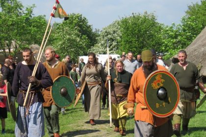 People dressed as Viking warriors in a Viking village
