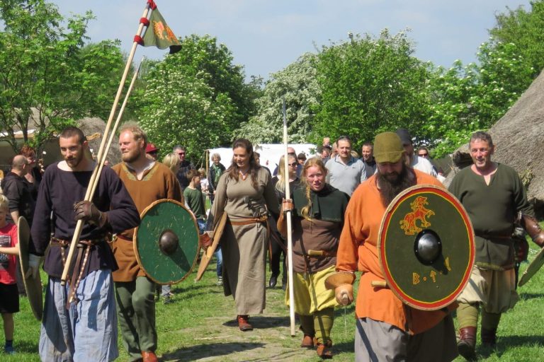 People dressed as Viking warriors in a Viking village