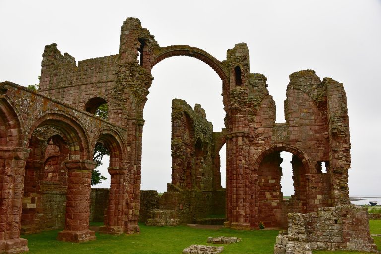 The red sandstone ruins of Lindisfarne Priory on Holy Island, Northumberland, site of the 793 Viking raid