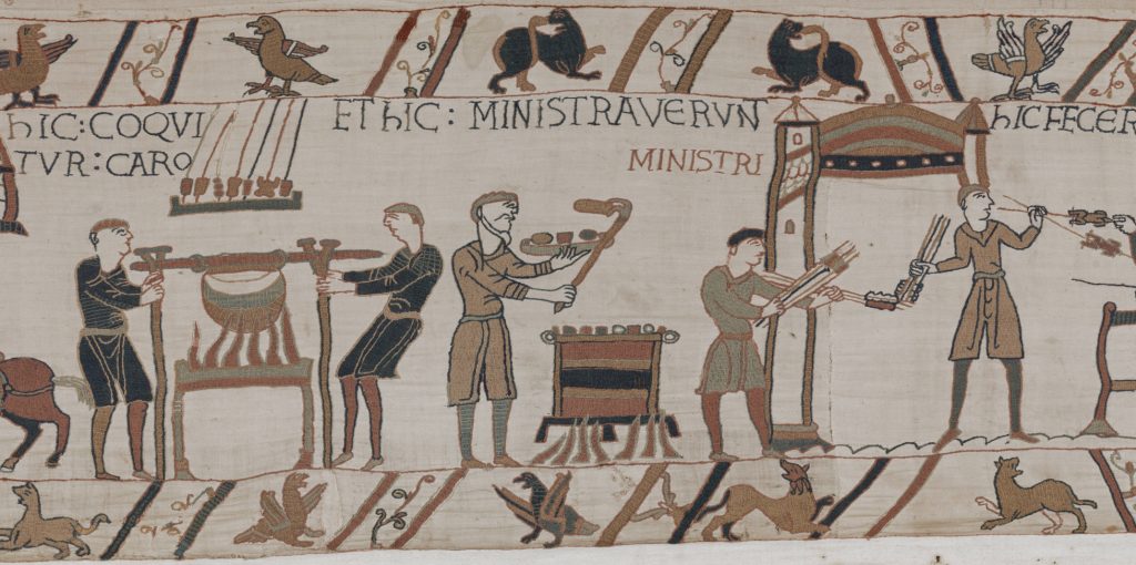 Embroidered cooks boiling meat in a cauldron and roasting it on spits in the Bayeux Tapestry