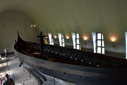 The Gokstad Viking longship, a long dark oak hull with its mast, displayed in the Viking Ship Museum in Oslo
