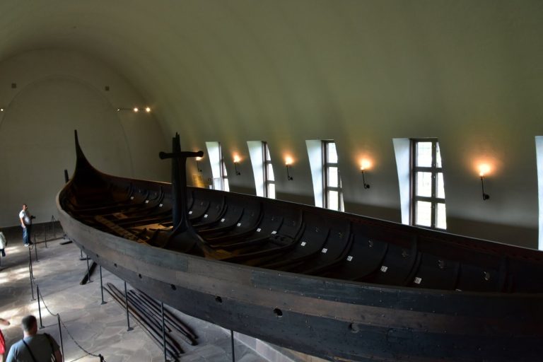 The Gokstad Viking longship, a long dark oak hull with its mast, displayed in the Viking Ship Museum in Oslo