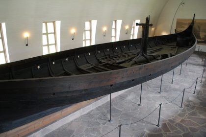 The Gokstad Viking ship on display in the long white hall of the Viking Ship House, Oslo